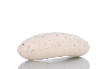 One fragrant bar of soap, close-up, isolated on white.
