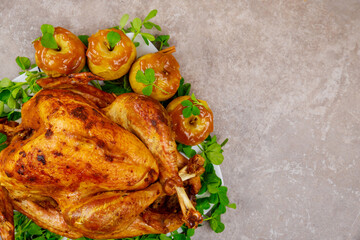 Holiday roasted turkey garnished with caramel apples and clover leaves.