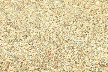 Wooden shavings background, wood dust texture, sawdust pattern, top view. Wood industry concept, eco energy