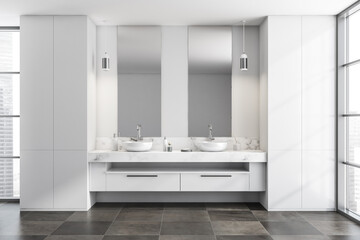 Bright bathroom interior with double sinks, two mirrors, panoramic window
