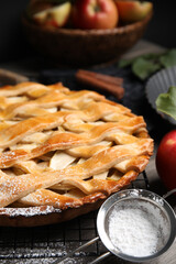 Delicious traditional apple pie on table, closeup