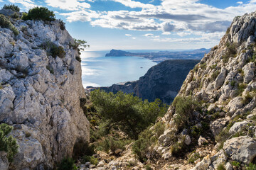 Fototapeta na wymiar limestone rocks cloudy sky and beautiful view of the Mediterranean sea scenic mountain landscape in spain