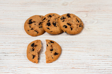 Chocolate chip cookies on a wooden table.