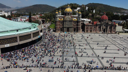Aerial view of the sacred Basilica Virgin of Guadalupe with a lot of visitors during a sunny weekend in Mexico City, Mexico. - obrazy, fototapety, plakaty