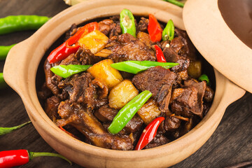 Stewed duck with potatoes in casserole