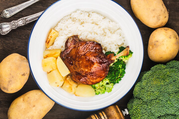 A plate of roast duck leg rice
