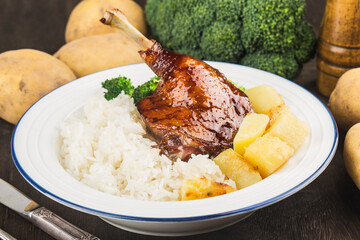 A plate of roast duck leg rice