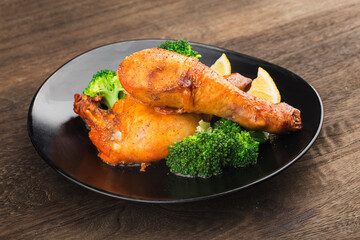 Grilled chicken leg with boiled potatoes and vegetable