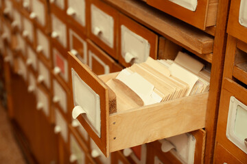 Obraz na płótnie Canvas Closeup view of library card catalog drawers