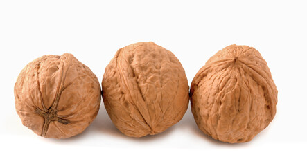 Isolated walnuts on a white background. Three nuts.