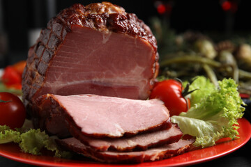 Plate with delicious ham, lettuce and tomatoes on black wooden table, closeup