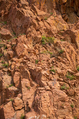 Red granite rocks in the Ush-Kanyr gorge. In the mountains of the eastern Tien Shan