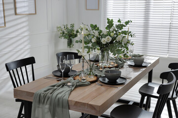 Festive table setting with beautiful tableware and decor indoors