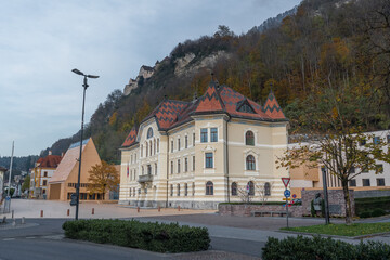 Government House of Liechtenstein (Regierungsgebaude) with Liechtenstein Parliament and Vaduz Castle on Background - Vaduz, Liechtenstein