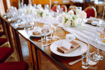 Festive table. Banquet table with wedding and festive serving. Wedding, birthday, party, event concept.
