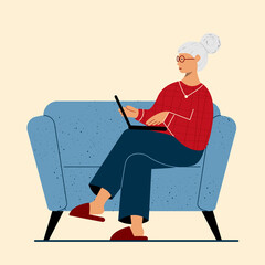 Grandma with Laptop sitting on the sofa at home