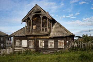Unitsa village, Kondopozhsky district of Karelia, Zaonezhie, Russia - October 12, 2021, Abandoned wooden two-storey house. Wooden architecture
