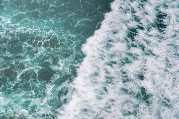 Fototapeta na wymiar Aerial view of sea waves - Water and foam Pattern