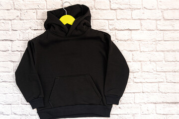 Black sweatshirt with a hood mockup template.