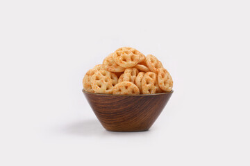 Fried and Spicy wheel Snacks or Fryums (Snacks Pellets) served in a bowl. selective focus - Image