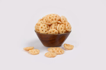 Fried and Spicy wheel Snacks or Fryums (Snacks Pellets) served in a bowl. selective focus - Image