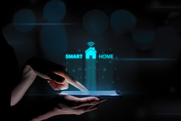 Smart home concept with a hologram over a tablet in the hands of a woman