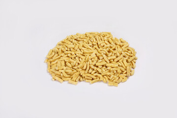 Gathiya Indian Namkeen Bhavnagari Gathiya or Ganthiya. Besan Gathiya Popular Gujarati snack made from gram flour (chickpea flour), isolated served in Yellow bowl on white background. Deep fried snacks