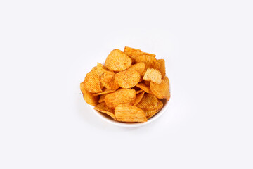 Bowl of tasty ridged potato chips on white background | top angle beautiful focused
