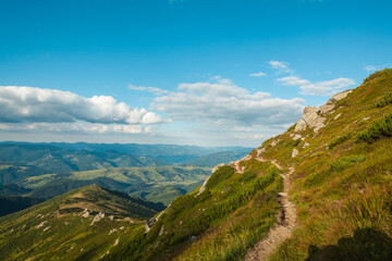 Narrow hiking trail on the hillside of the mountain, Ukrainian carpathians
