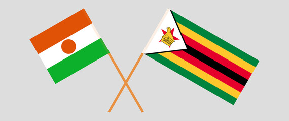 Crossed flags of Niger and the Republic of Zimbabwe. Official colors. Correct proportion