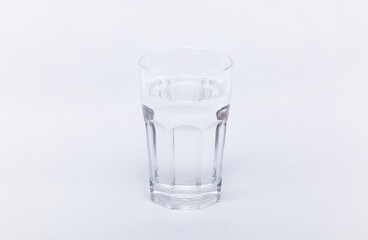 Glass with water on a white background