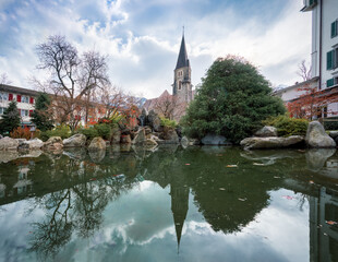 Fototapeta na wymiar Japanese Garden and St Joseph Catholic Church - Interlaken, Switzerland