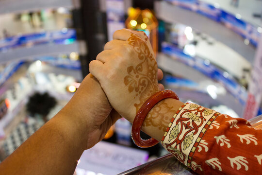 Point-of-view (POV) of a man holding a woman's hand