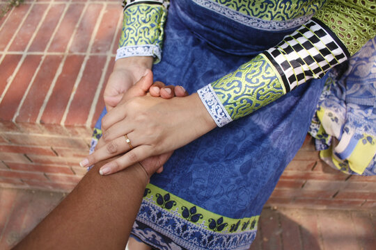 Point-of-view (POV) of a man holding a woman's hand