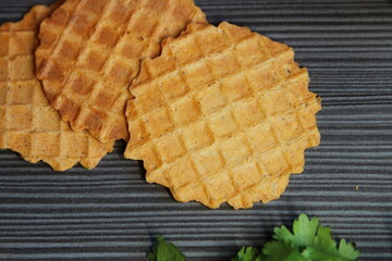 Food photo. Waffles on a dark wooden background.