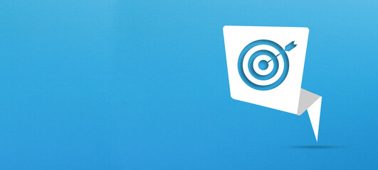 Target sign with speech bubble on blue background