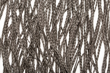 Afrokos, Dreadlocks close-up. Braided by a master hairdresser in the salon, hair braided in dreadlocks. African braids on a white background.