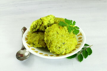 traditional indian gujarati spicy snack food kapuriya gora or kapuria gola steamed rice lentils...