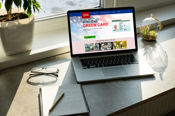 laptop with Permanent resident card of USA website