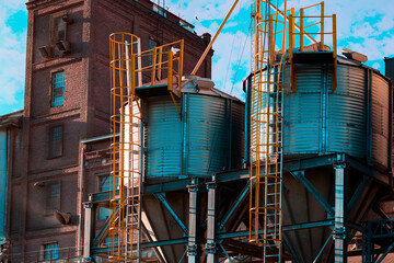 A view in perspective of a pair of silos of a flour factory a country town near Cordoba Argentina