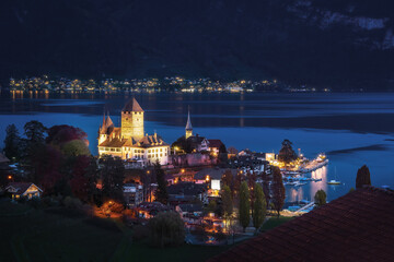 Aerial view of Spiez Castle and Castle Church at Lake Thun at night - Spiez, Switzerland