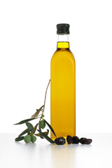 Extra virgin olive oil in a glass bottle isolated on white background.