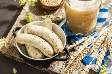 Oktoberfest set. Unfiltered beer, weisswurst, spikelets of grain, hop