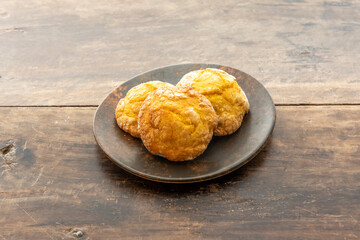 Delicious trio of lemon cookies with glass sugar on vintage wooden table