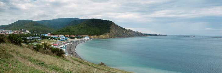 Fototapeta na wymiar Panorama. Sea bay. Pebble beach. Resort village. Autumn