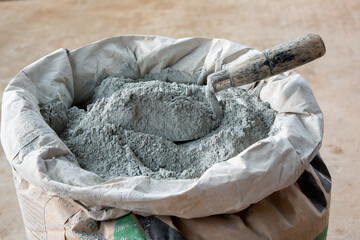 .Cement powder and trowel put in bag package..