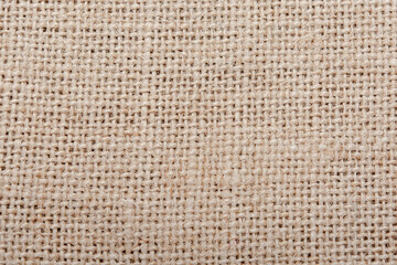 Burlap, sackcloth brown grainy cotton cloth texture background.