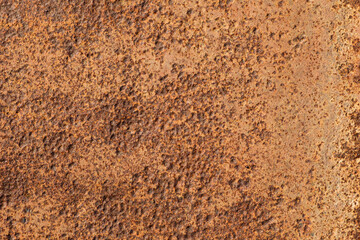 The old metal surface is corroded by rust under the influence of time and the environment.