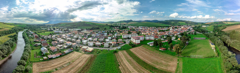 Fototapeta na wymiar Aerial view of the of Podolinec town in Slovakia, along with its river