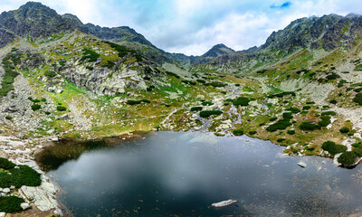 Panoramic view of Skok waterfall and the lake in the western part of High Tatras, Slovakia © Martin Valigursky